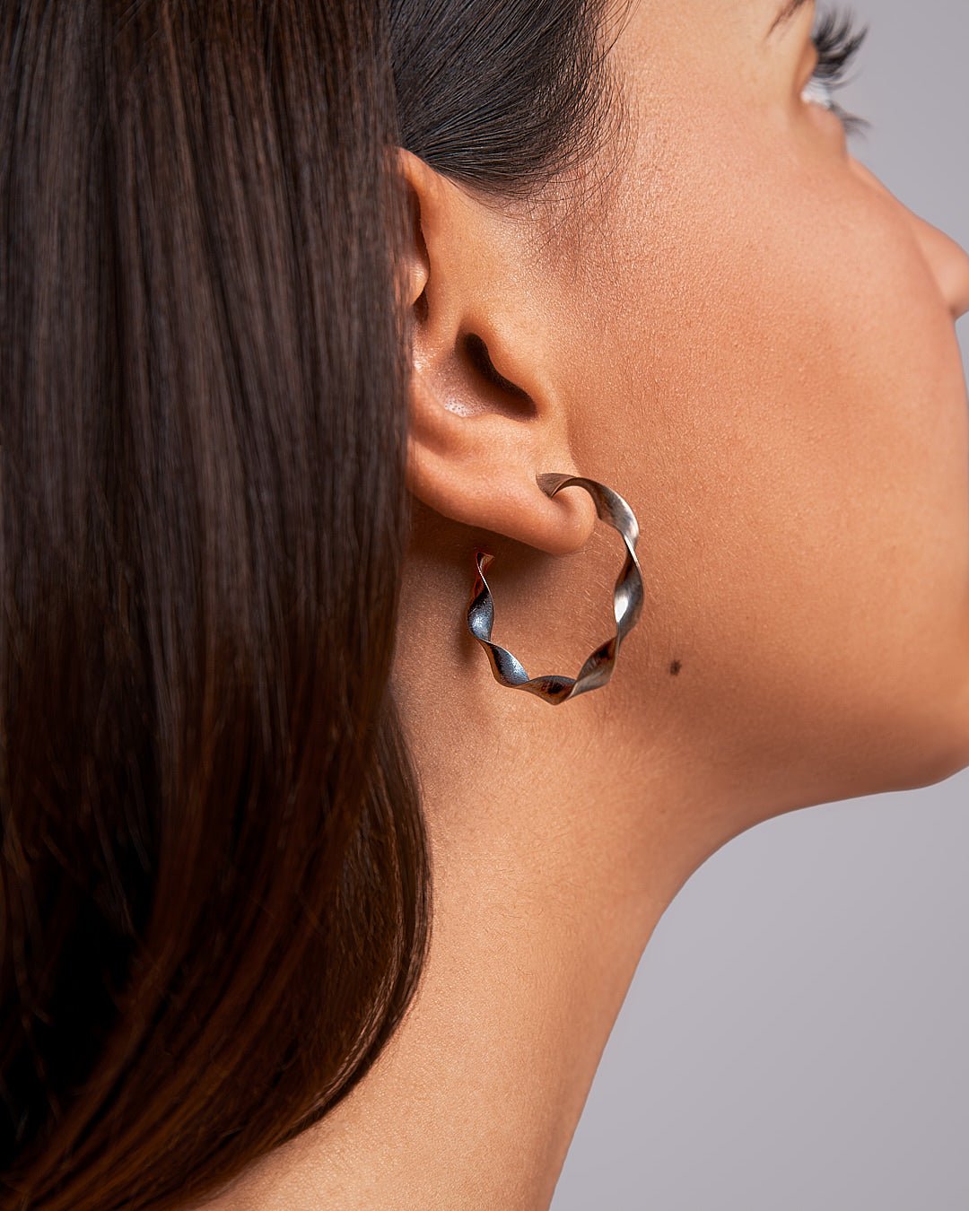 Why Do My Hoop Earrings Turn Sideways? - Lunai Jewelry