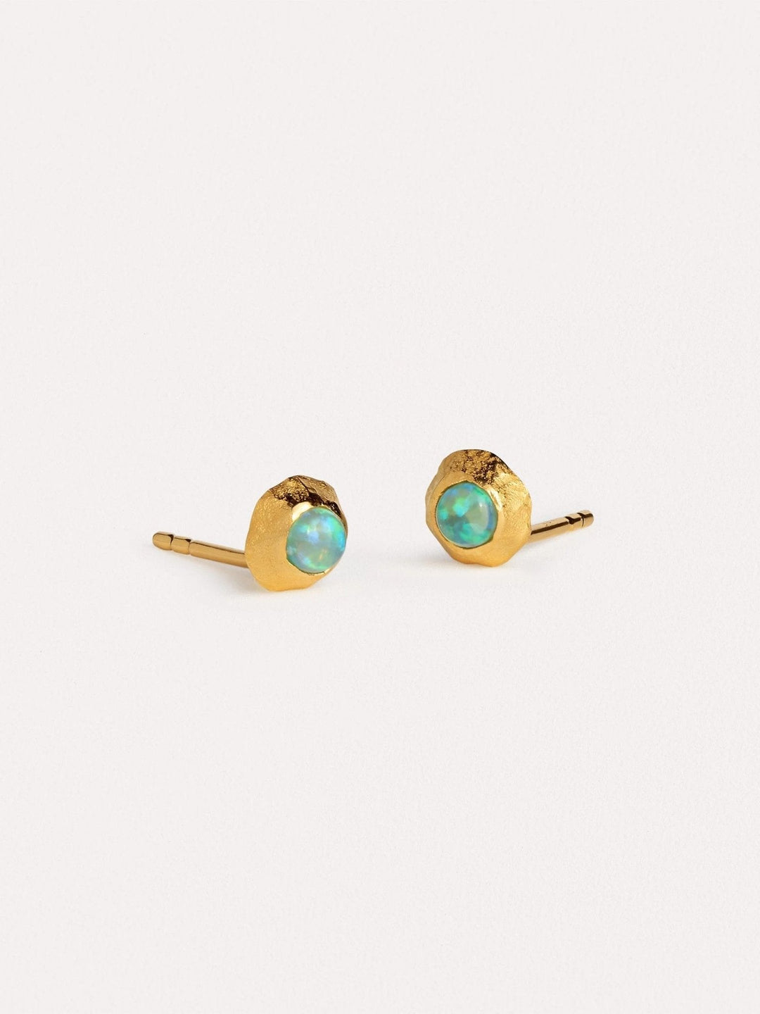 Elegant gold and gemstone earrings with a modern, timeless design.