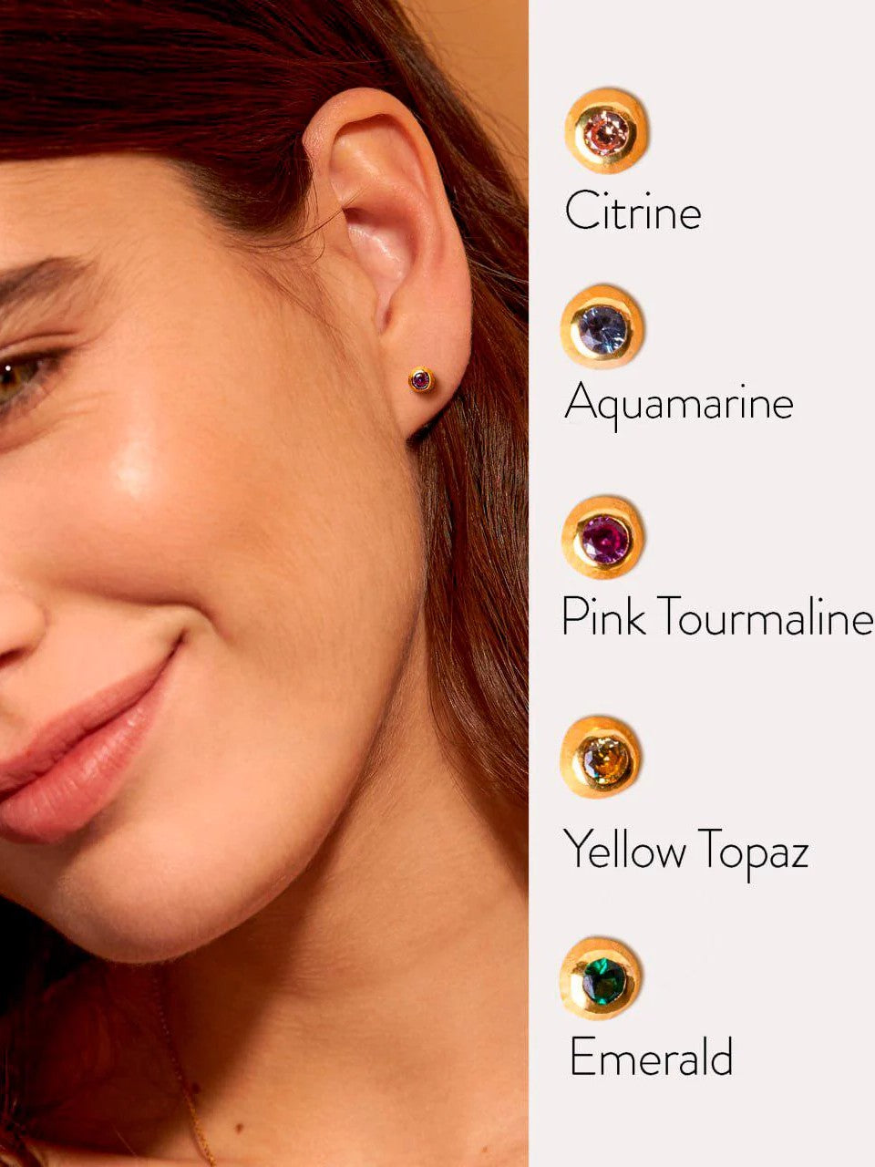 Smiling woman wearing a small gold stud earring, with gemstone options displayed on screen.