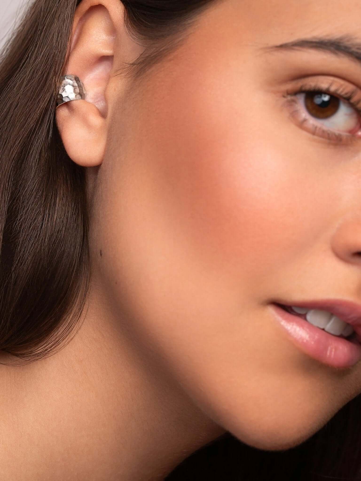 Alternate angle of the silver hammered conch cuff, designed for eco-conscious, modern wearers.
