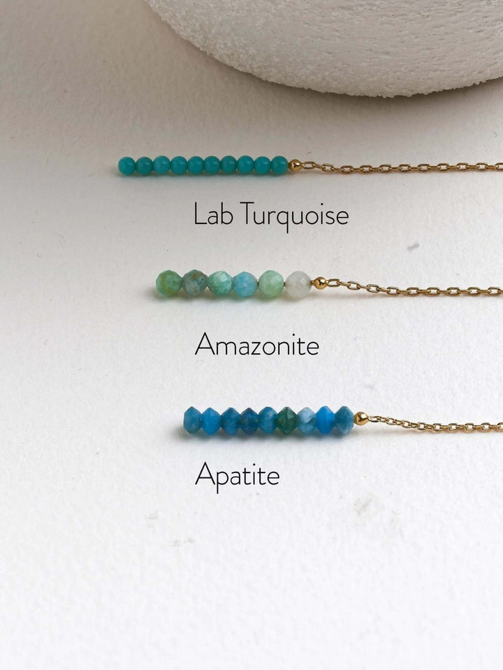 Gold gemstone threader earrings in Turquoise, Amazonite, and Apatite, available in multiple colors.
