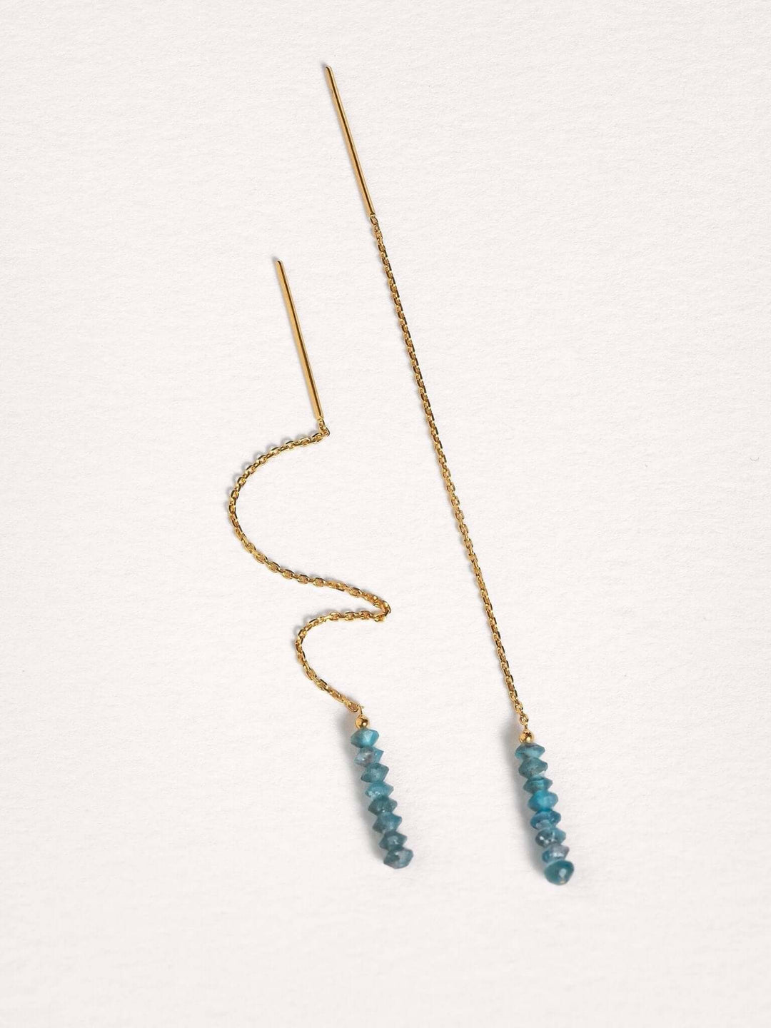 Flexible gold chain threader earrings with apatite gemstones, showcasing lightweight movement.