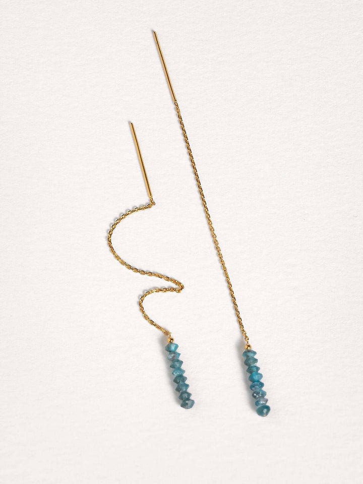 Flexible gold chain threader earrings with apatite gemstones, showcasing lightweight movement.