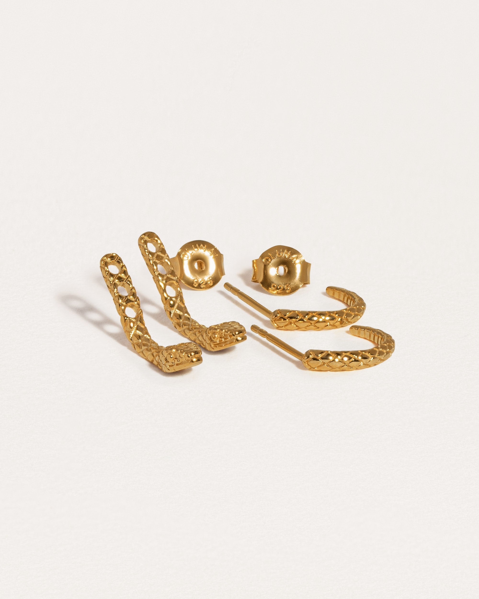 Snake ear jacket earrings in 24K gold-plated finish, featuring a delicate suspended snake design.