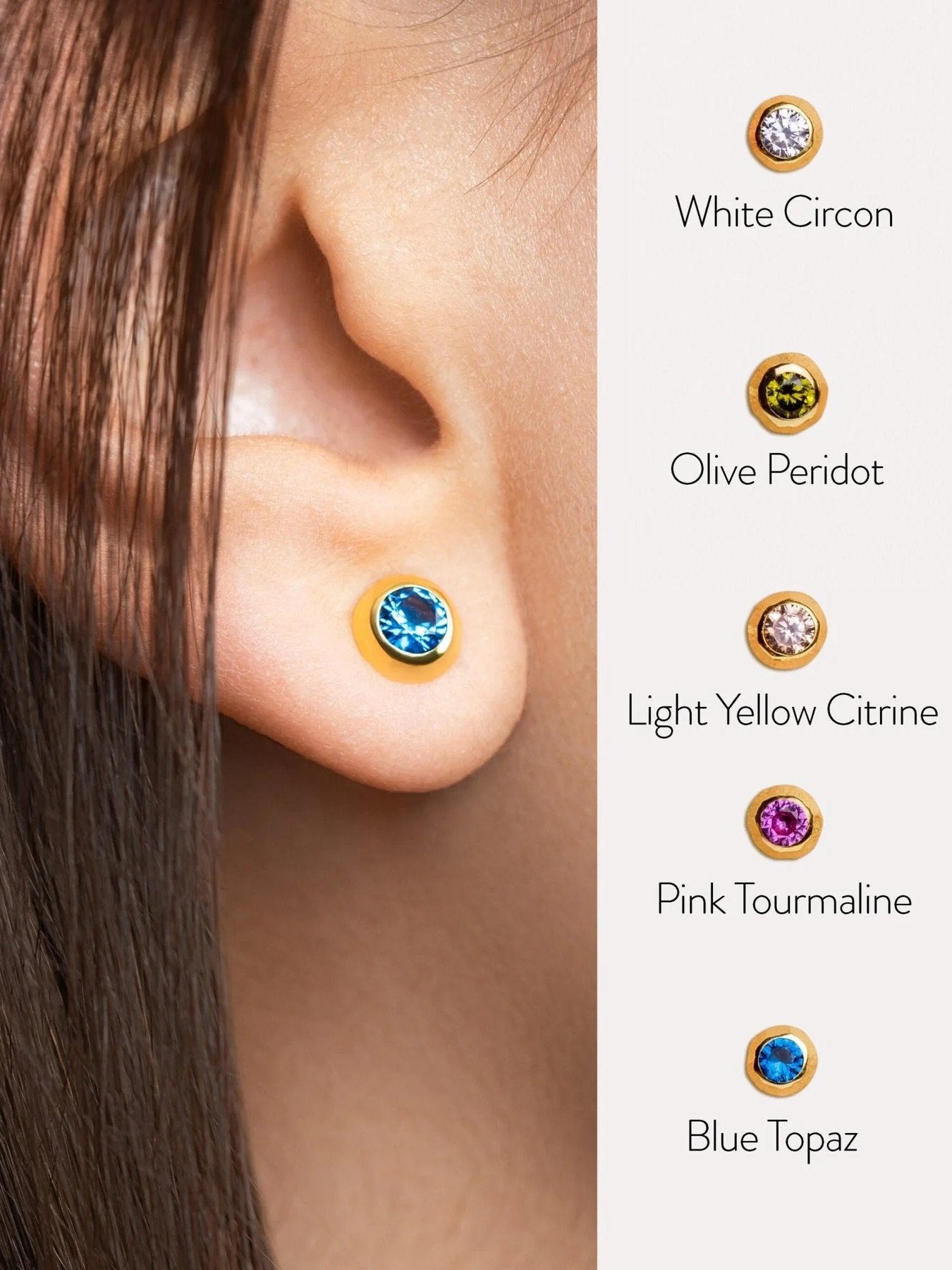 Blue stone earring on ear with color guide – comparison of different gemstone options available in the same earring design.