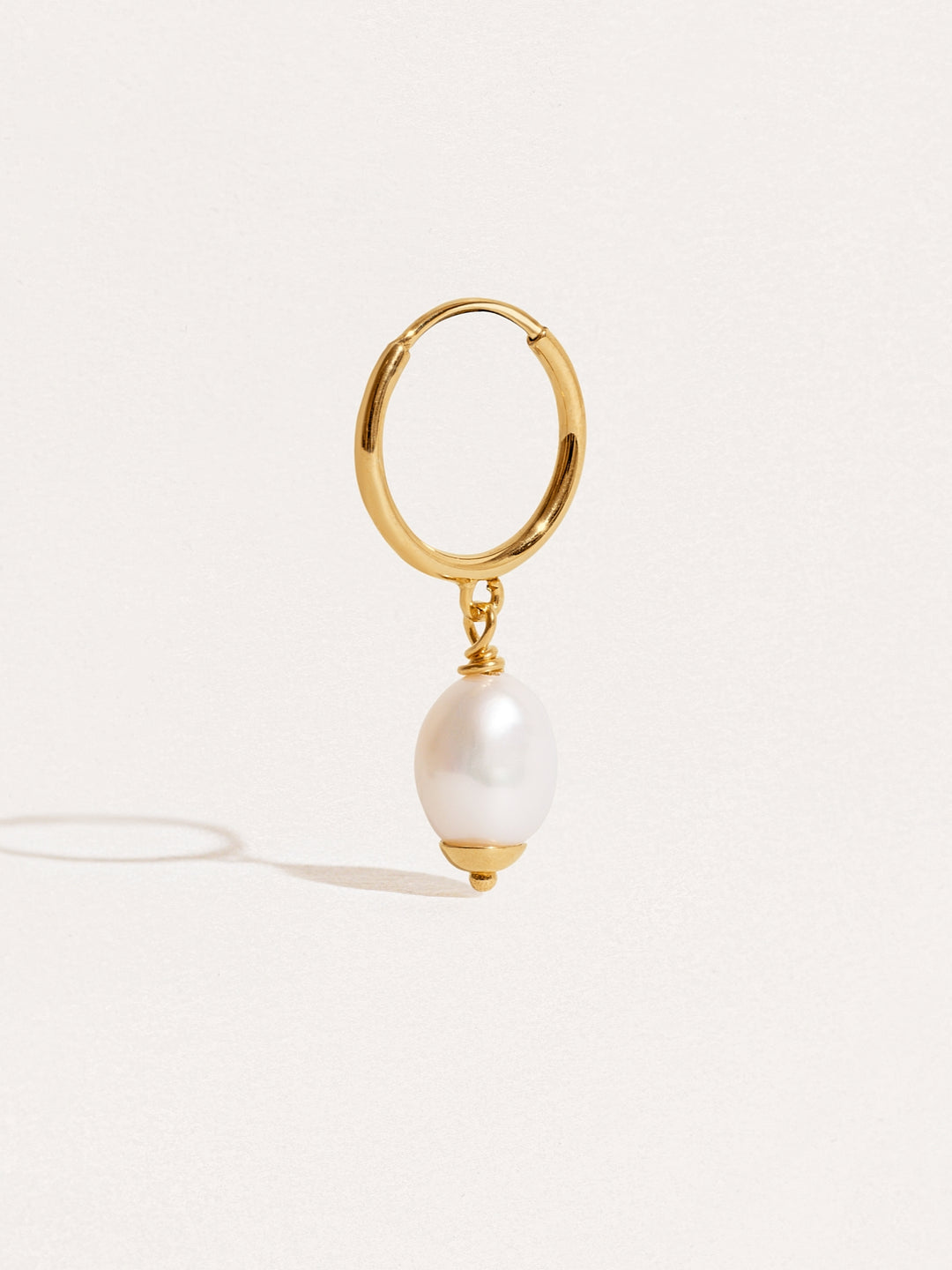 Stunning and elegant Bold Pearl Drop Earrings with gold accents and intricate design
