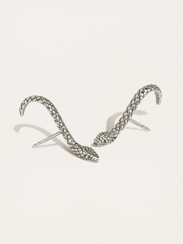 Snake Suspender Earrings in silver with intricate coiled design and dangling chains