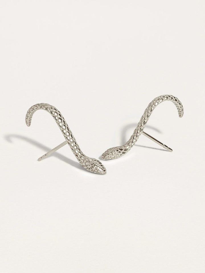 Unique Snake Suspender Earrings in gold featuring detailed snake head and sleek, dangling chains