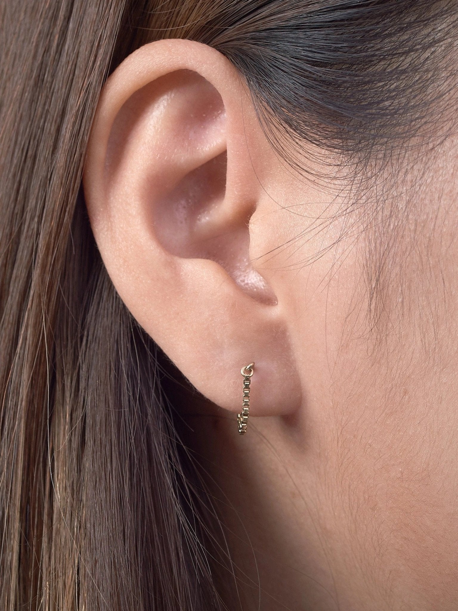 Close-up of earlobe with 24K gold plated chain earring
