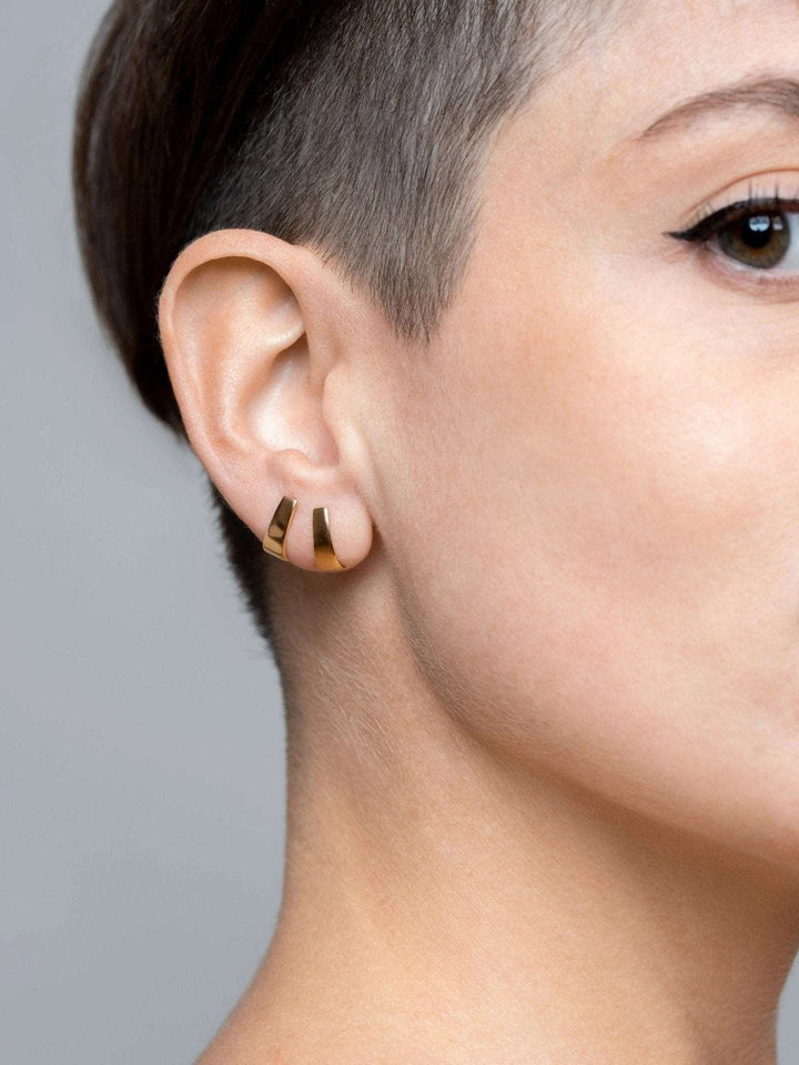 Terita stud earring in 24K gold plated finish — worn on ear with soft shine and minimalist elegance.