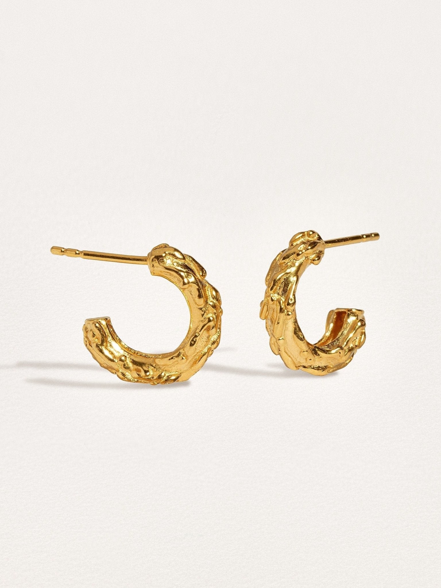 Side view of Groessa Raw Texture Open Hoop Earrings in gold plated highlighting unique design.