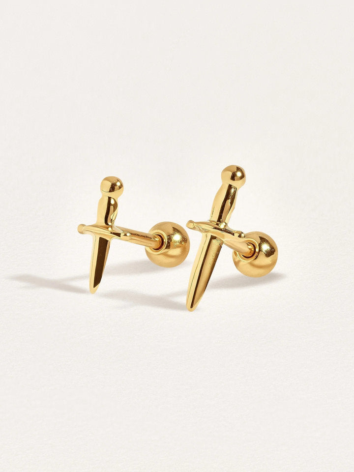 Two dagger earrings in 24k gold vermeil, side by side to show different dagger sizes and fine details of the design.
