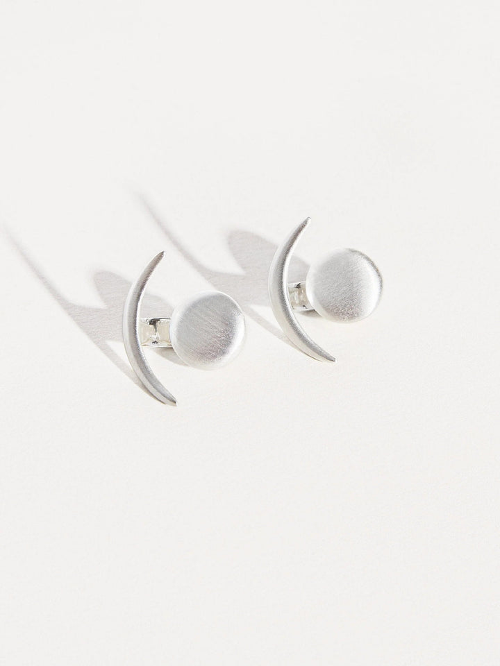 Sterling silver ear jackets, photographed on a white background with soft lighting.
