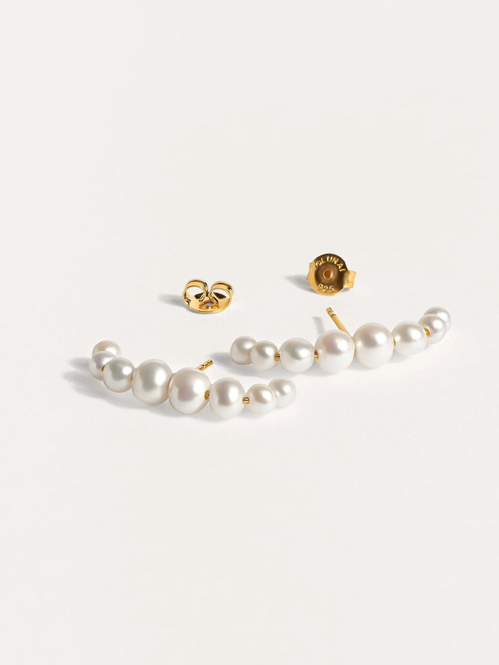 Detailed shot of the Solene pearl ear cuff, showcasing the handcrafted texture and 24k gold plating.