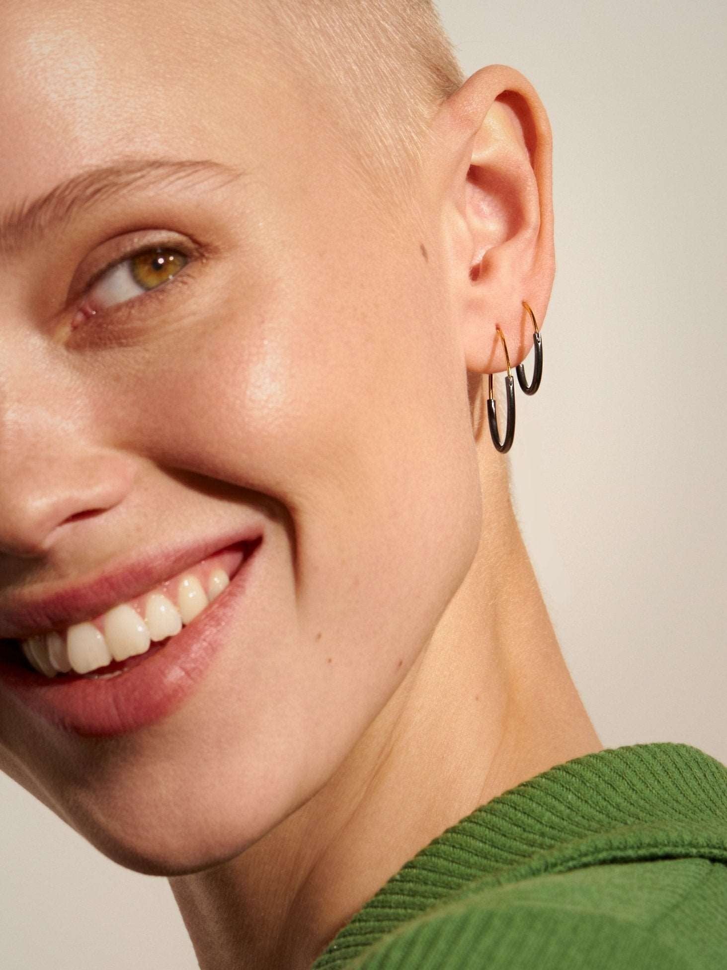Kim small hoop earring in gold filled — worn with a soft smile, delicate and radiant.