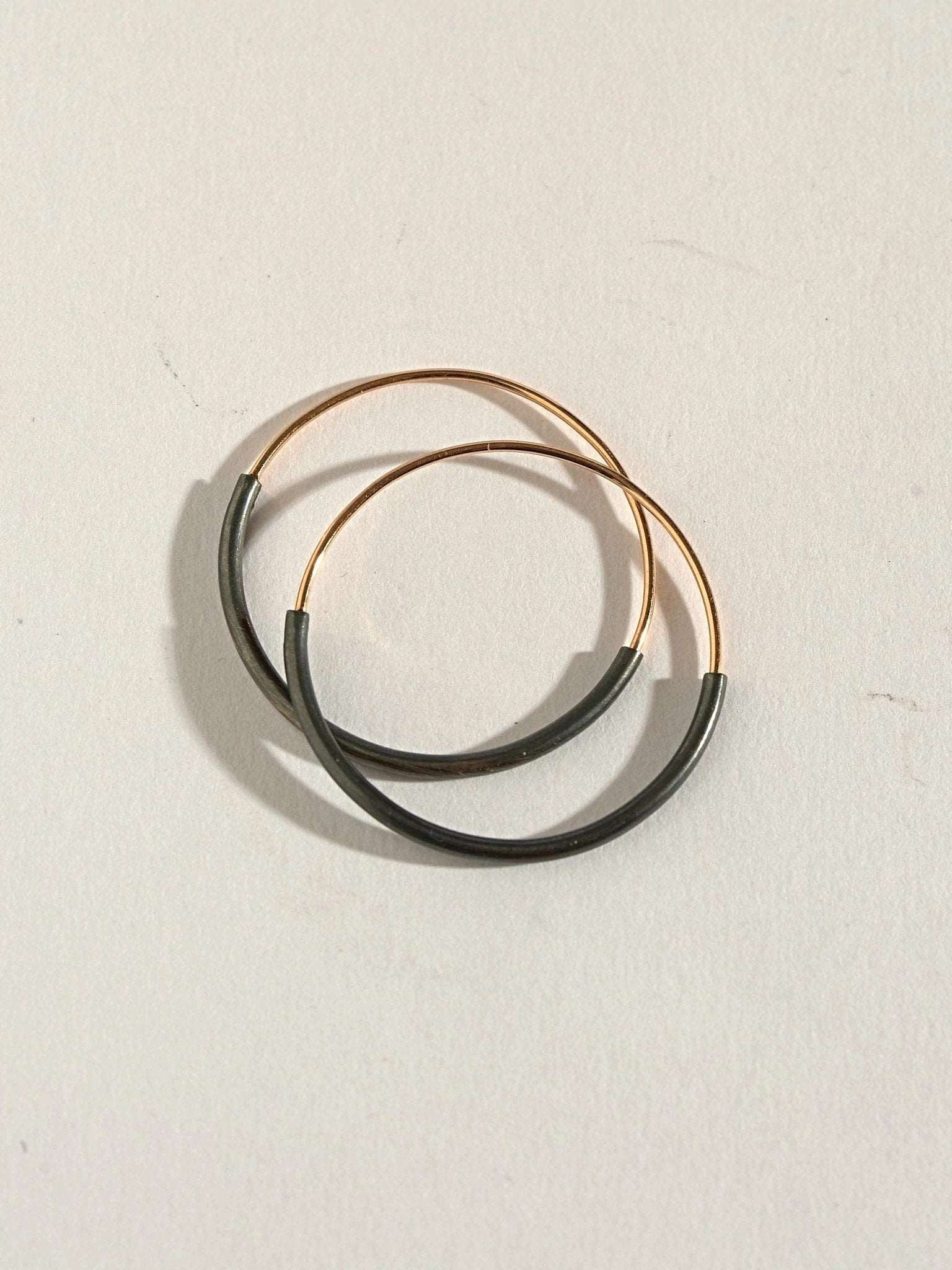 Kim hoop earrings in 14K gold filled — mid and large sizes displayed together.