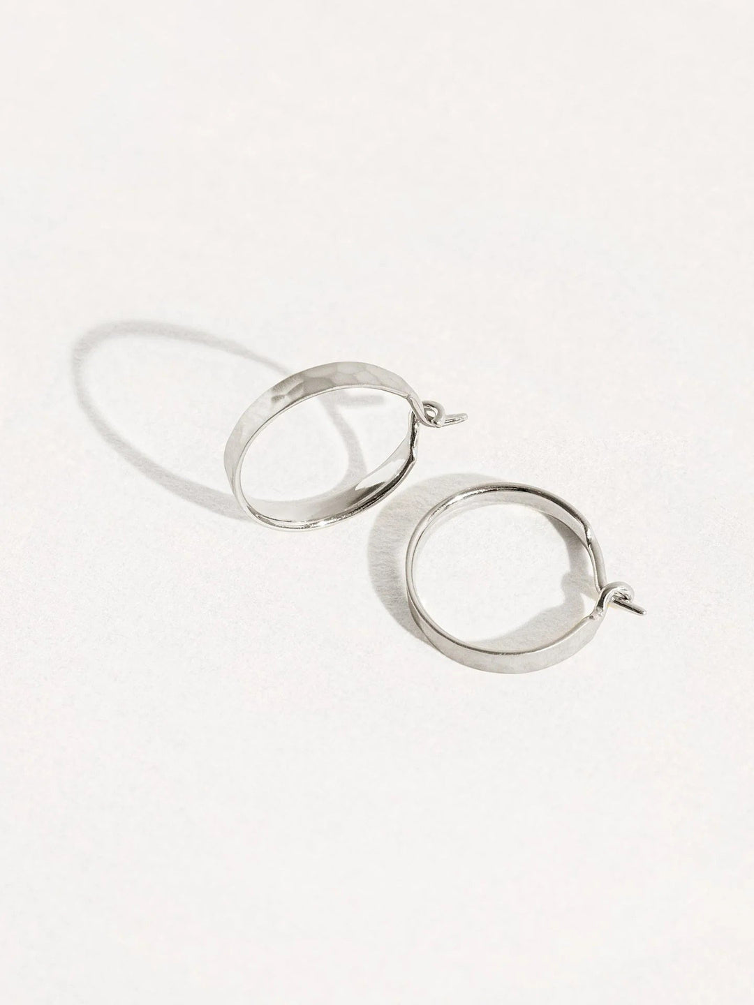 Medium hammered 925 sterling silver matte hoop earrings – chic and versatile design.