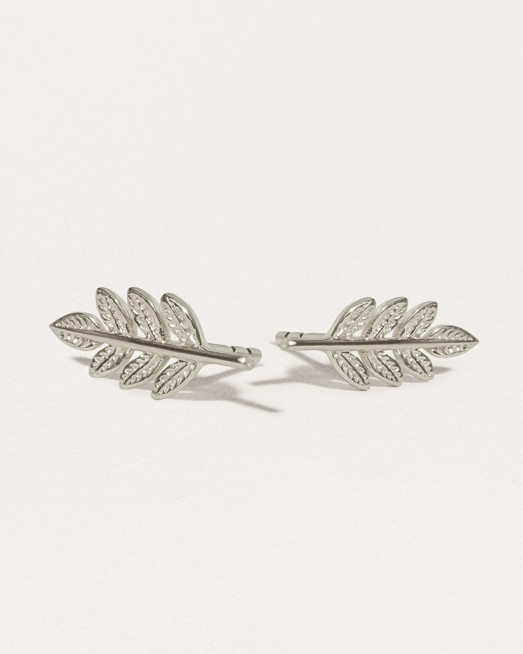 Gudrun leaf earrings in sterling silver — matte finish with intricate leaf texture.