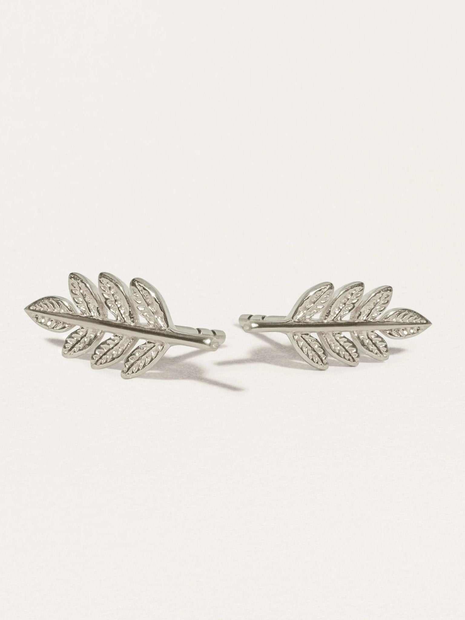 Gudrun leaf earrings in sterling silver — matte finish with intricate leaf texture.