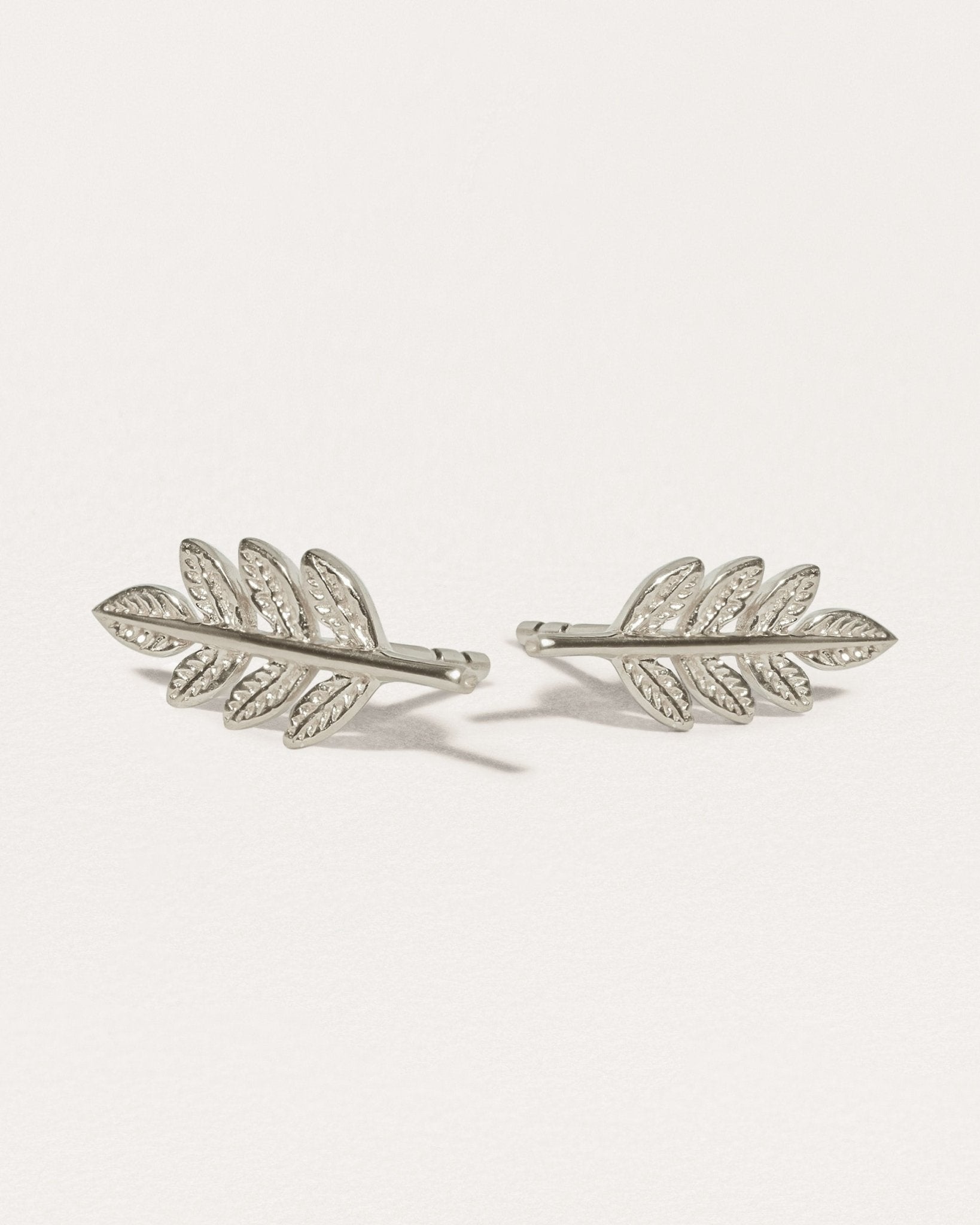 Gudrun leaf earrings in sterling silver — matte finish with intricate leaf texture.