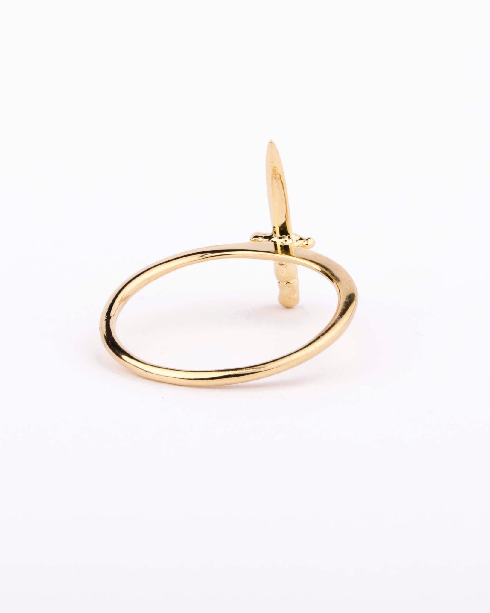 Side angle of gold vermeil dagger ring showing its delicate pointed detail.