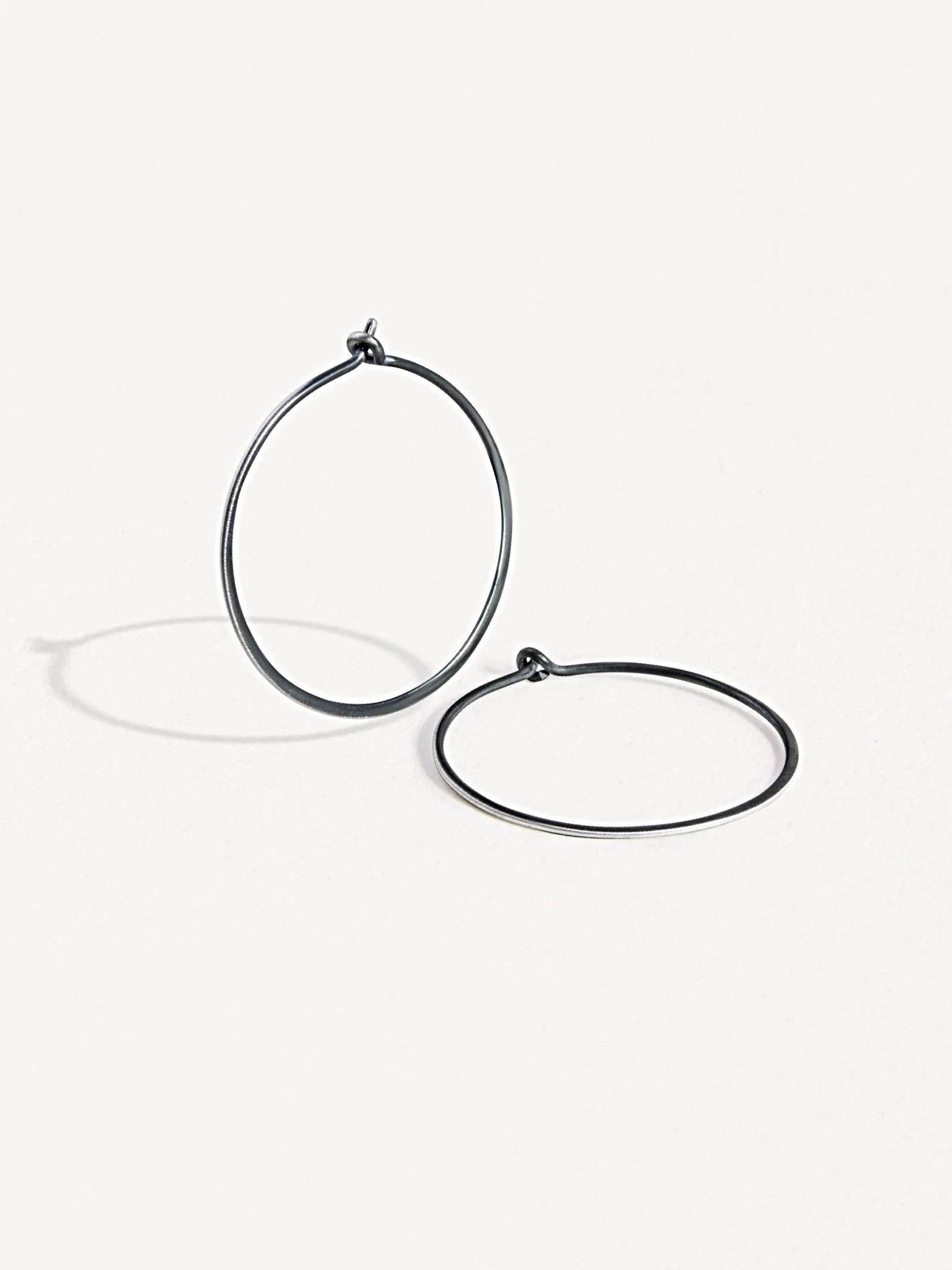 Oxidized sterling silver second-hole hoop earrings – minimalist and elegant design.