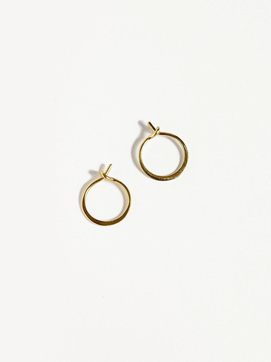 14K gold filled hoop earrings with a delicate open design on a white background.