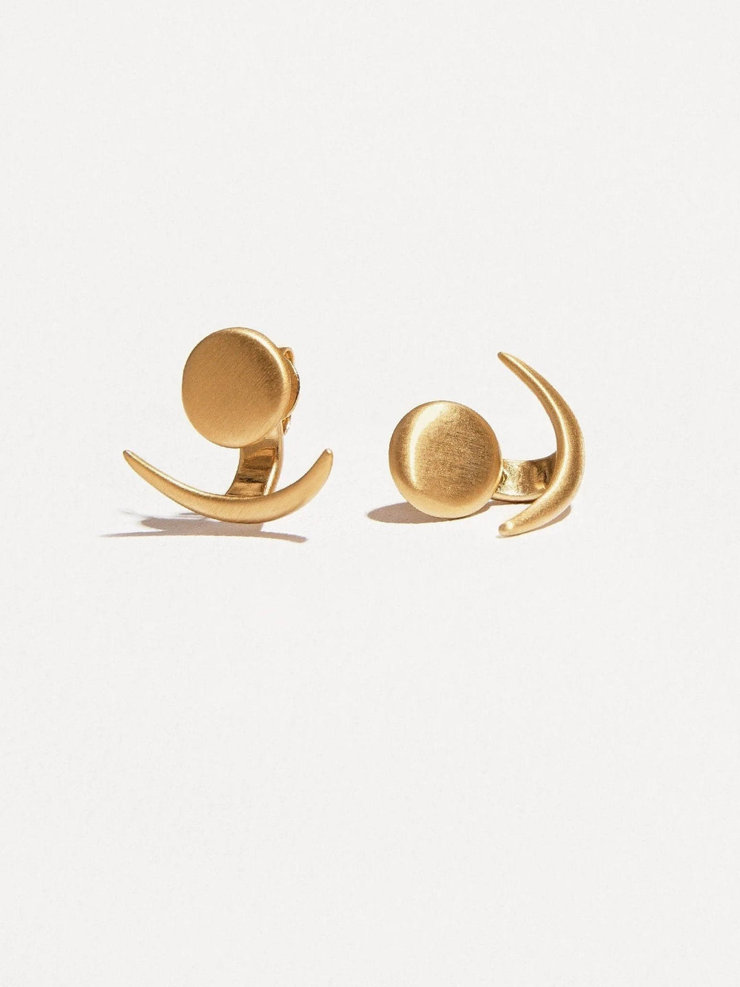 24K gold plated matte ear jackets on a white background, modern and minimalist design.