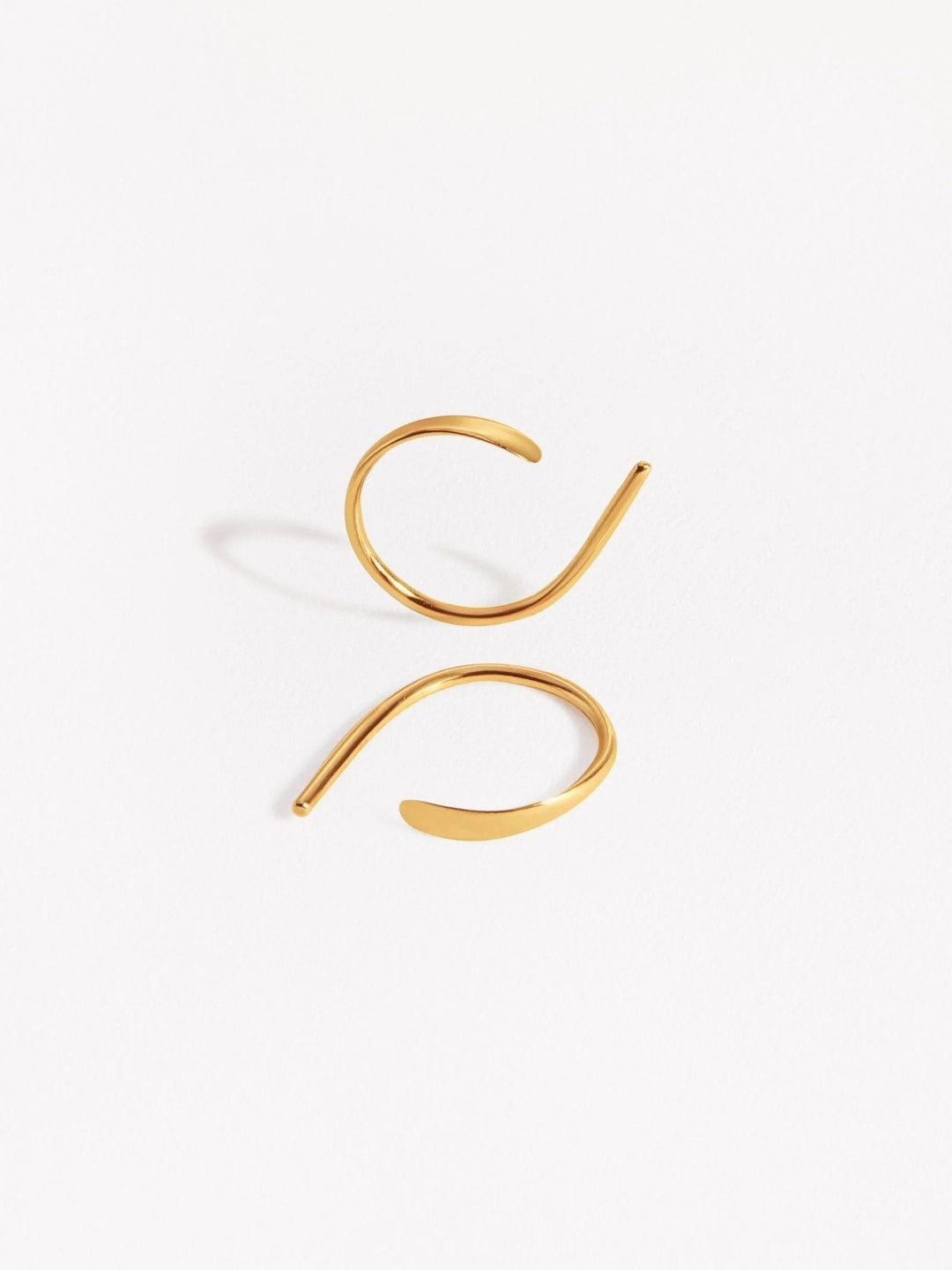 Noe hammered hoop earrings in sterling silver — handcrafted minimalist design on white background.