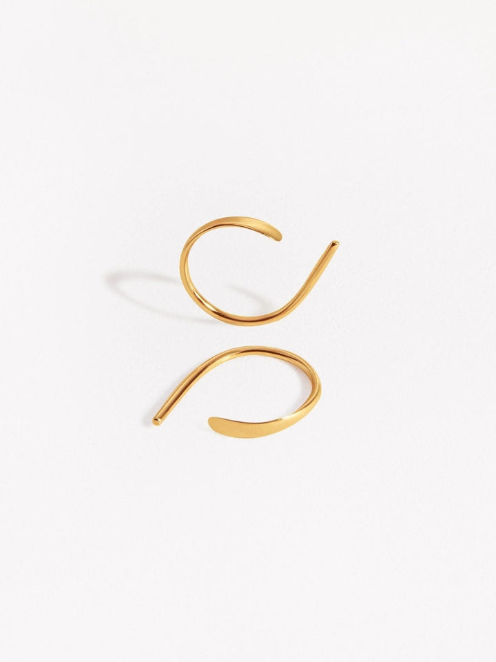 Noe hammered hoop earrings in sterling silver — handcrafted minimalist design on white background.