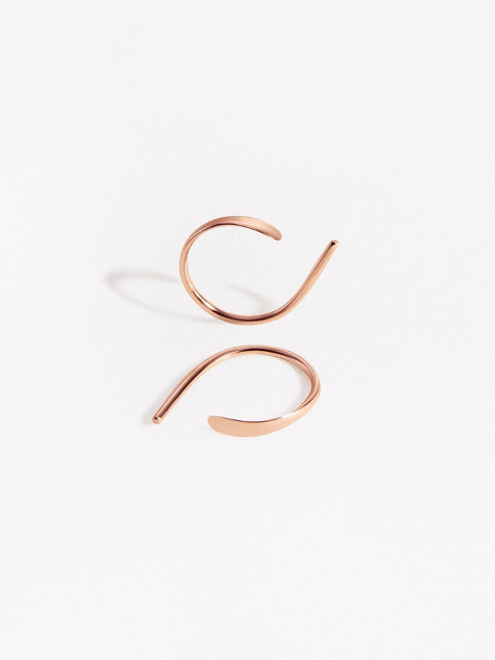 Rose gold version of Noe hammered hoop earrings — delicate and luminous design handmade in sterling silver.