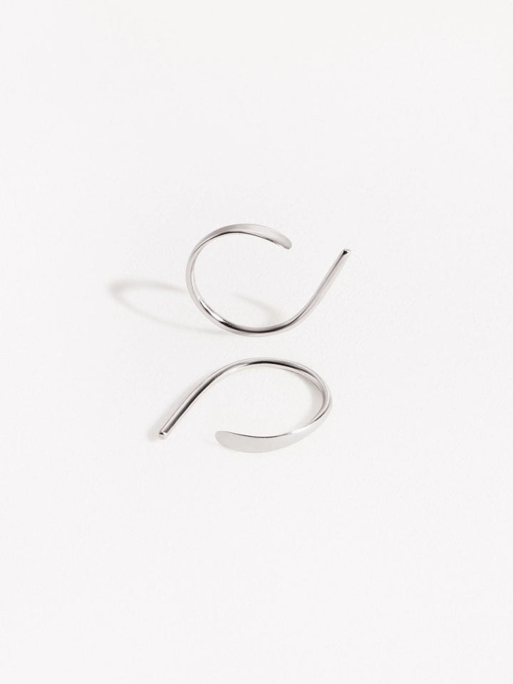 Sterling silver Noe hoop earrings with hammered front — handcrafted modern minimalist style.