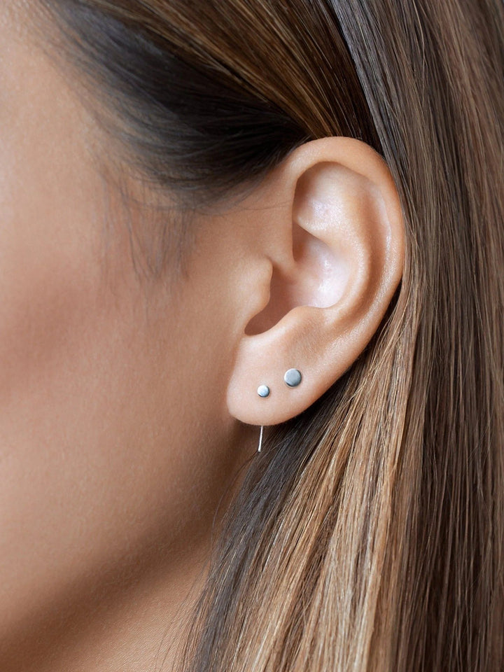 Close-up of 925 sterling silver open hoop earrings, perfect for everyday elegance