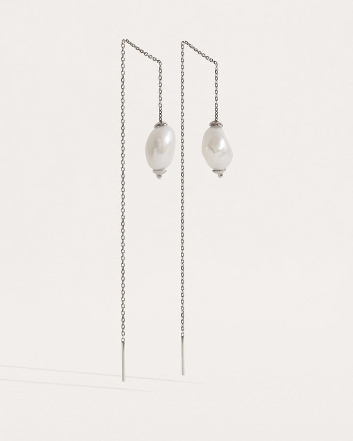 Front-facing view of threader earrings in sterling silver — minimalist chain with freshwater pearls.