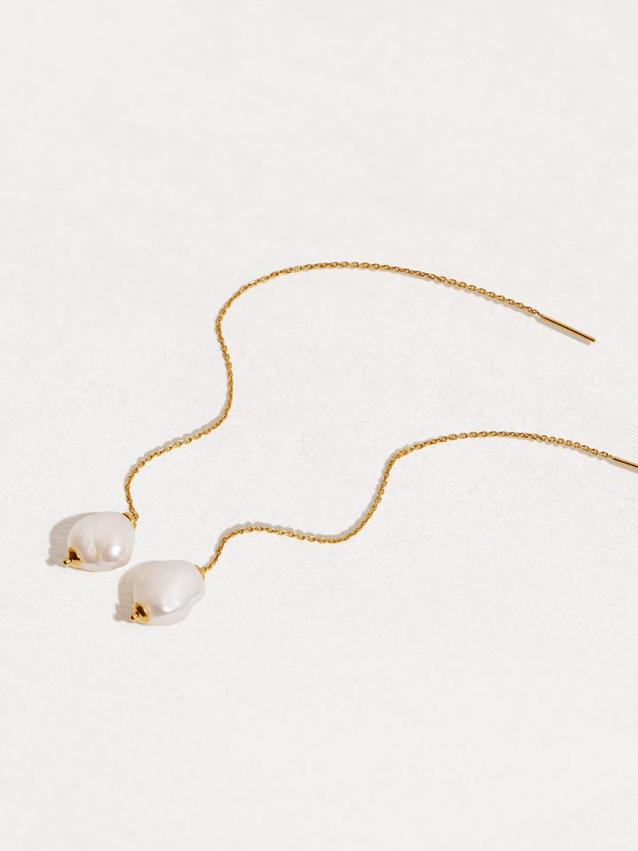 Pair of long threader earrings with freshwater pearls and 24K gold plated chain — elegant and minimal design on white background.