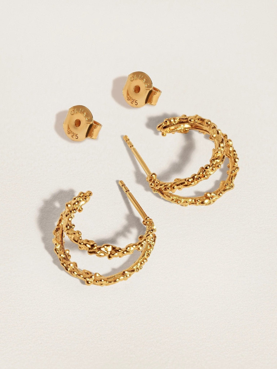 Close-up of the hypoallergenic stud of the Priana Gold Double Hoop Earrings.