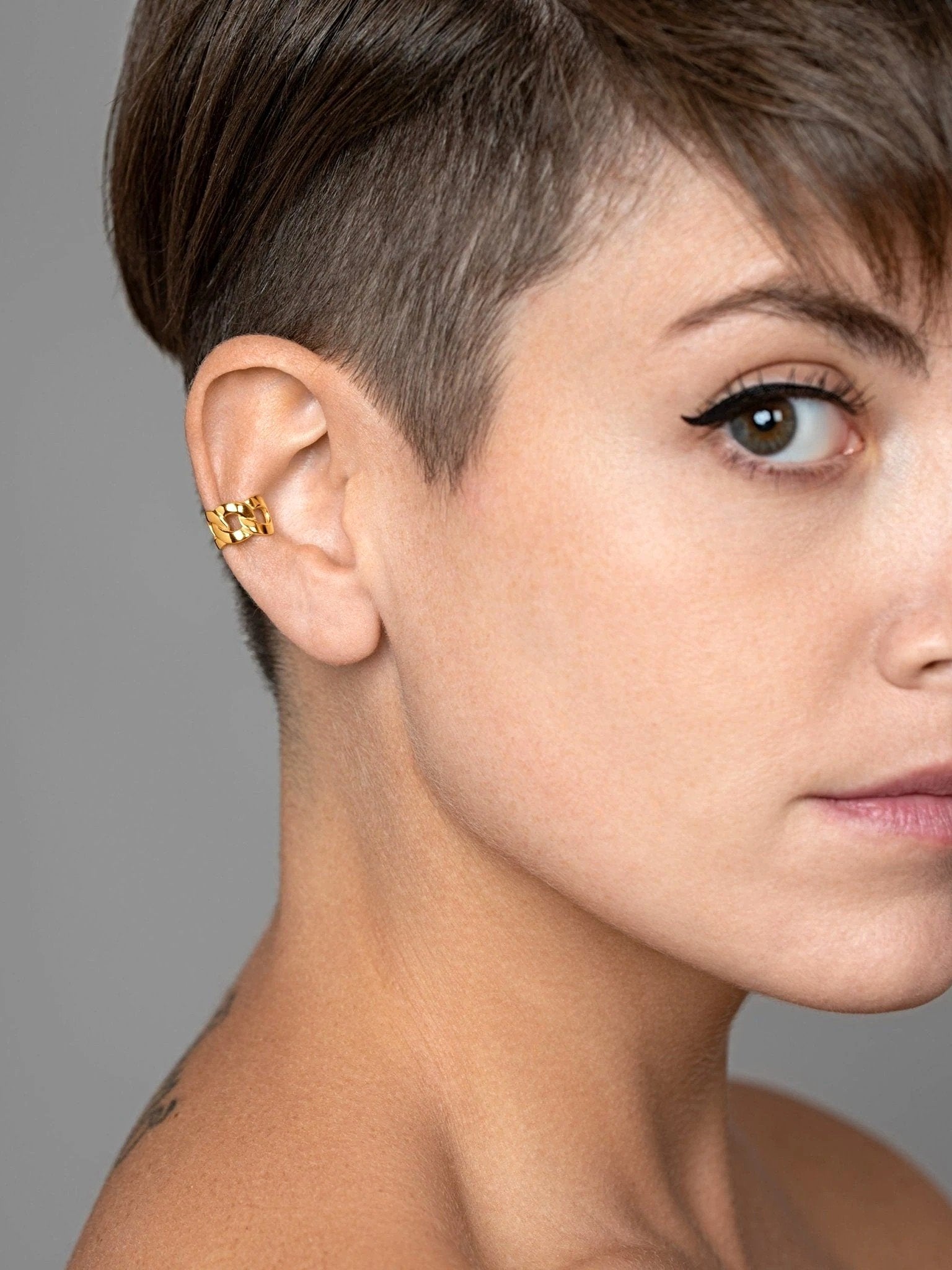 Renatte chain ear cuff in sterling silver — bold and minimal style on white background.