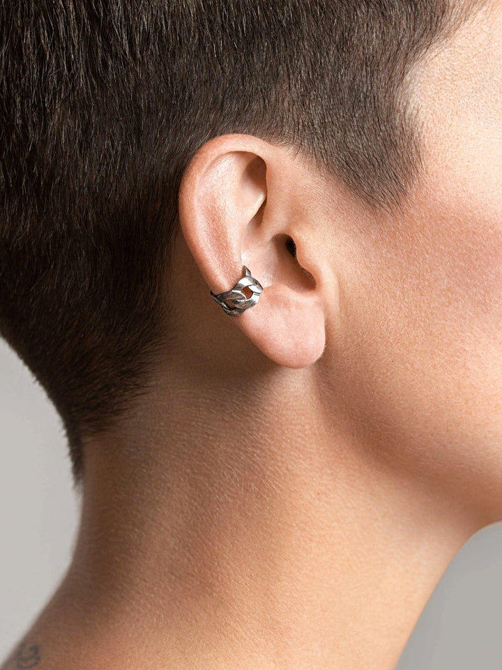 Silver Oxide Renatte ear cuff styled with short hair — minimalist and strong expression.