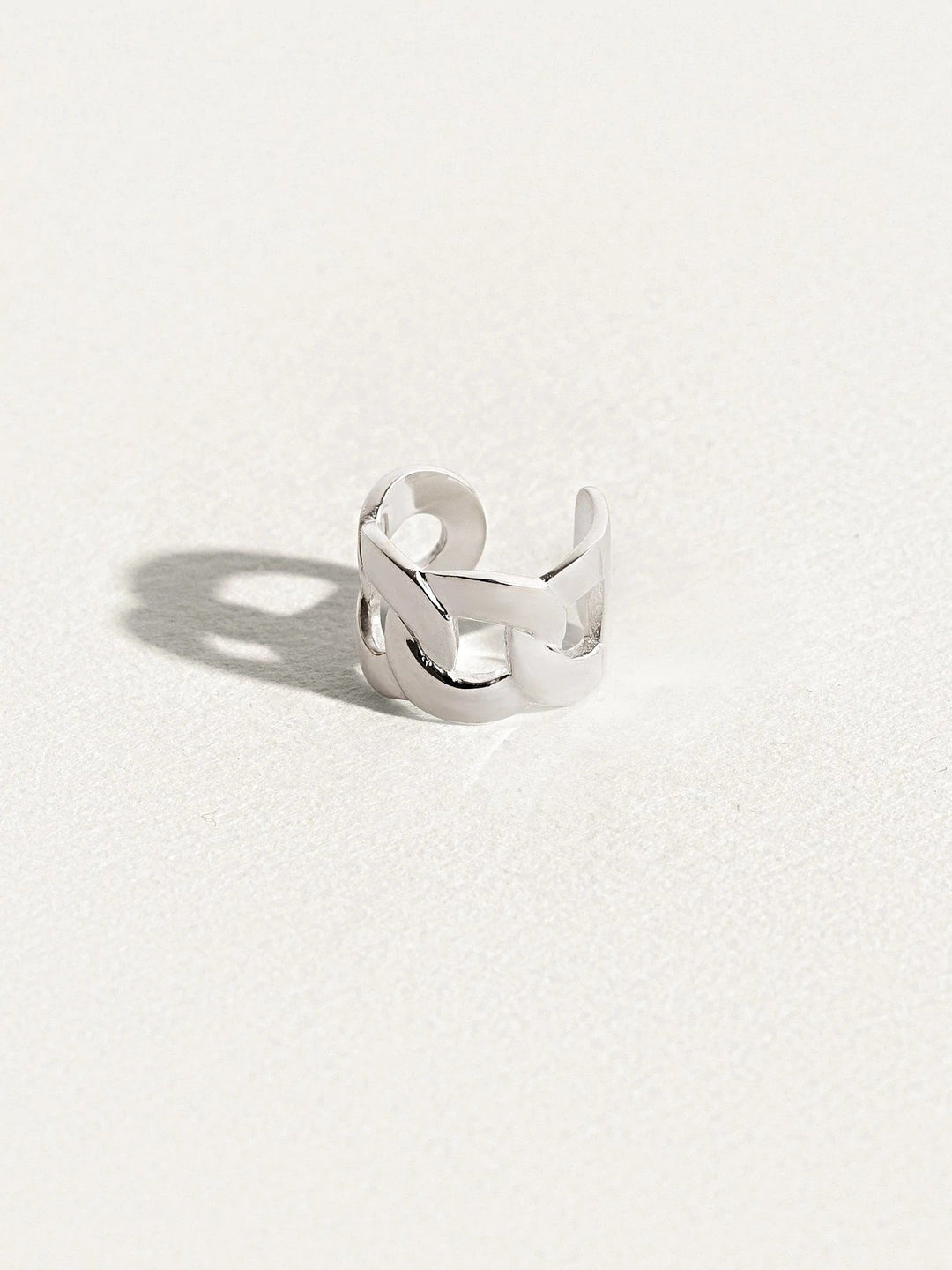 Silver Renatte chain ear cuff — handcrafted modern cuff with soft lighting.