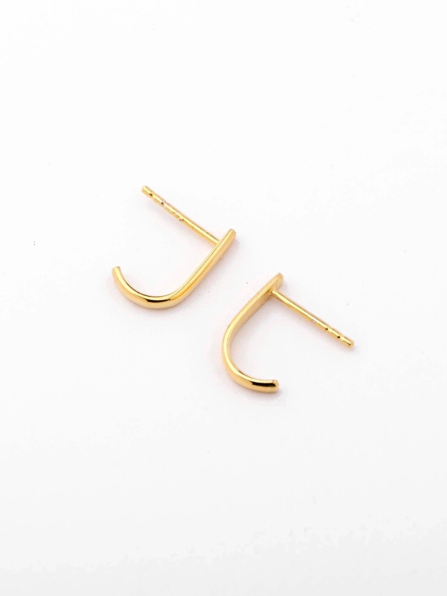 Sita bar earrings in gold plated and sterling silver finishes — sleek design displayed side by side.