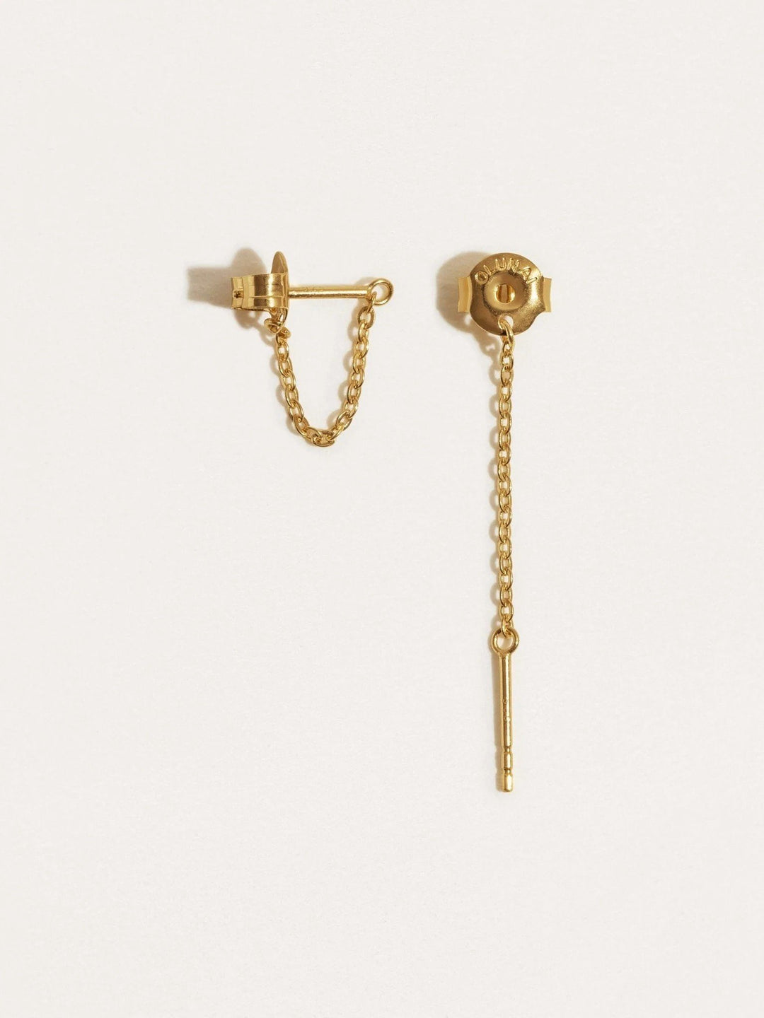 Gold chain stud earrings with butterfly backs visible