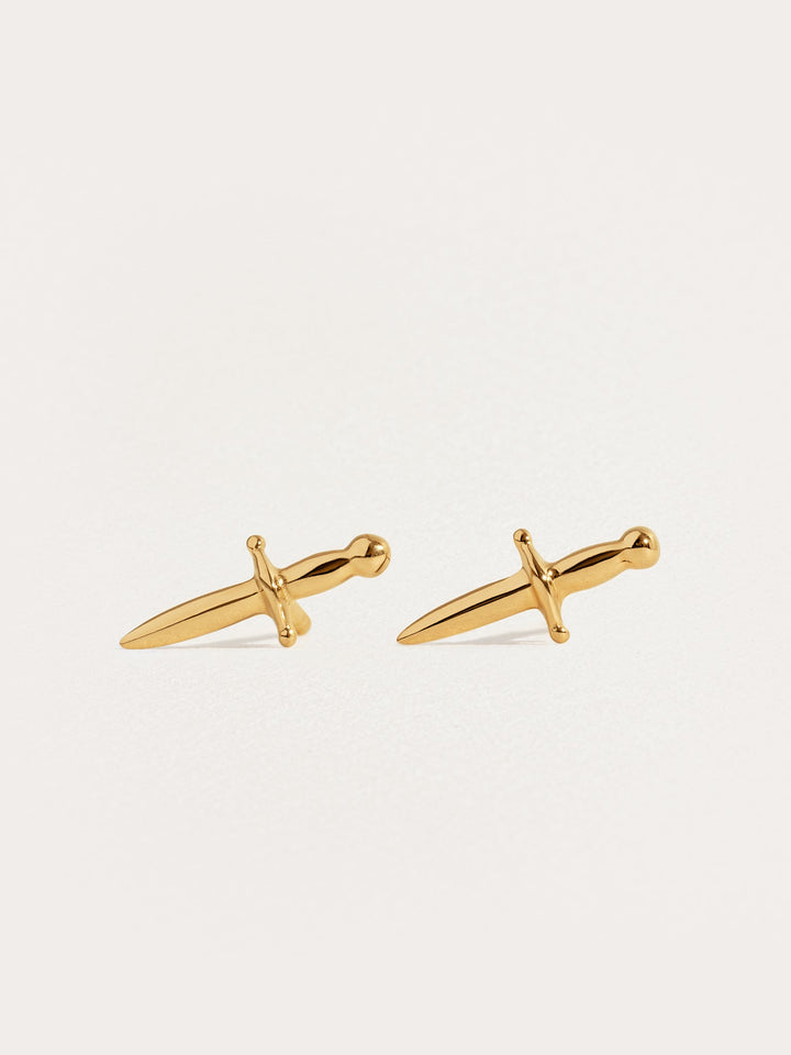 Tessa Sword Stud Earrings in 24K Gold Plated – Minimalist dagger earrings on white background"