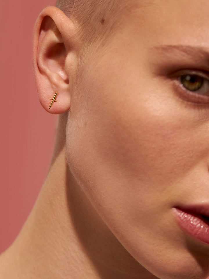 Model wearing Tessa Sword Stud Earrings in 24K Gold Plated – Sleek and modern jewelry
