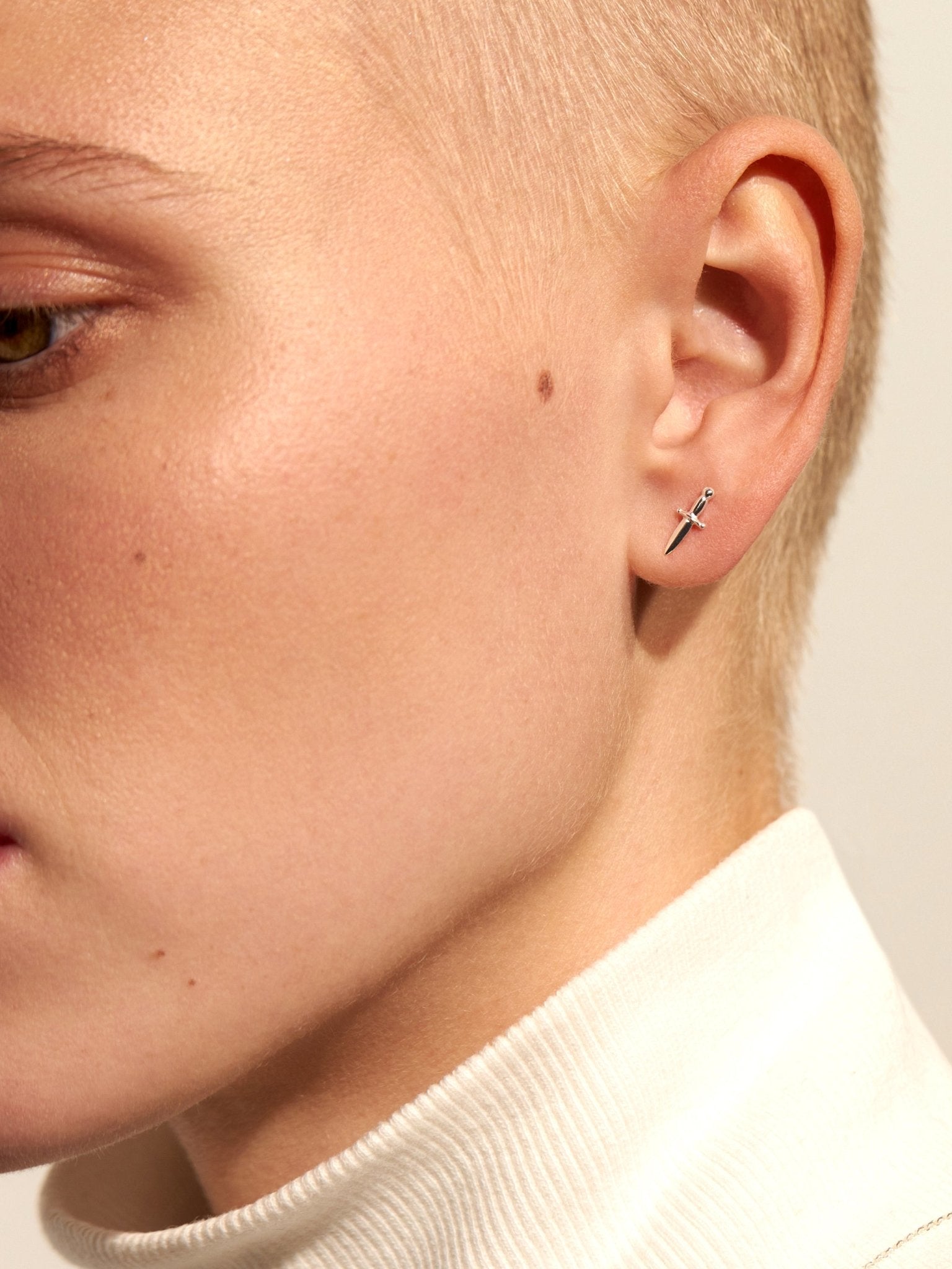 Model styling the Tessa Sword Stud Earrings – Chic and elegant jewelry piece