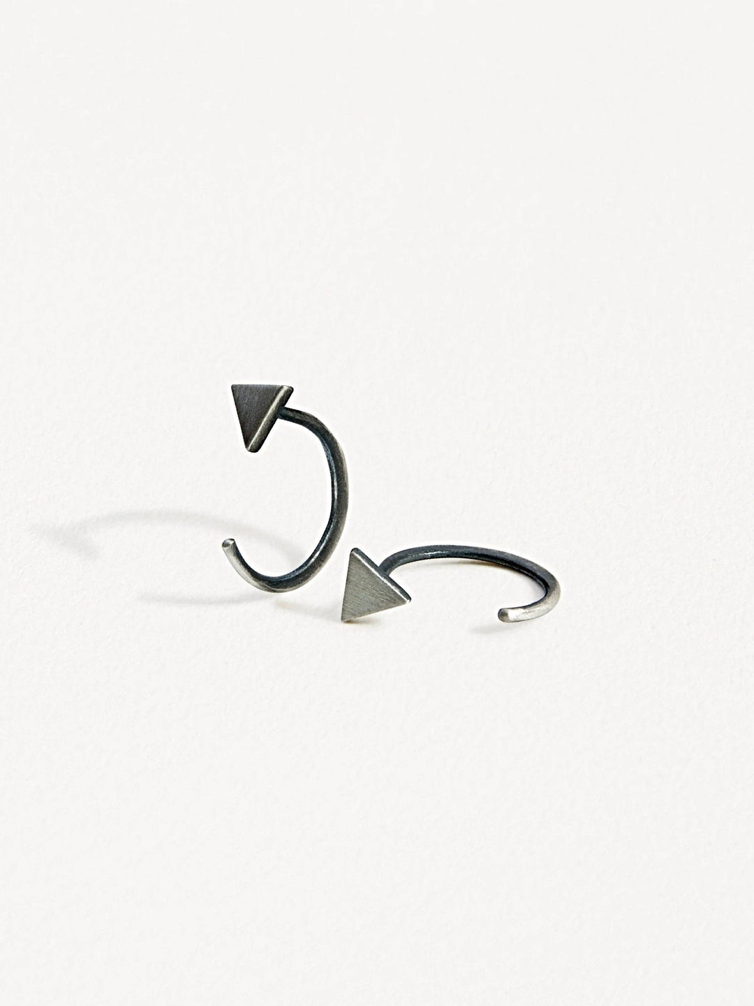 Geometric triangle huggie earrings in oxidized silver finish