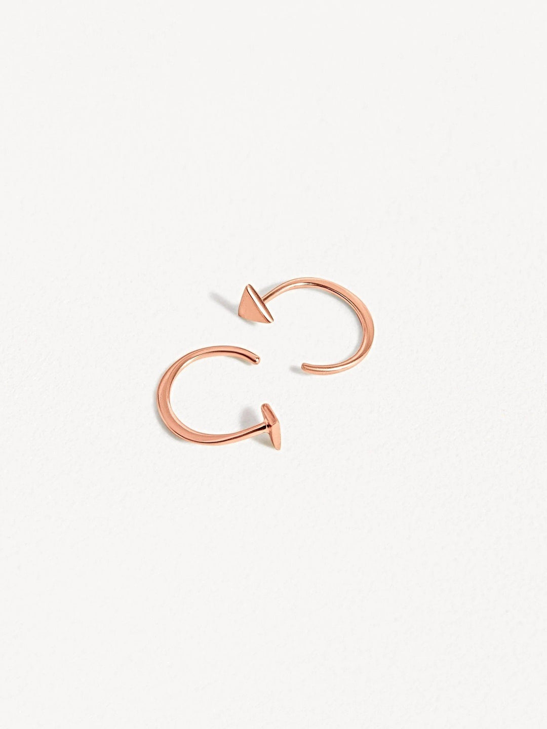 Geometric triangle huggie earrings in rose gold finish