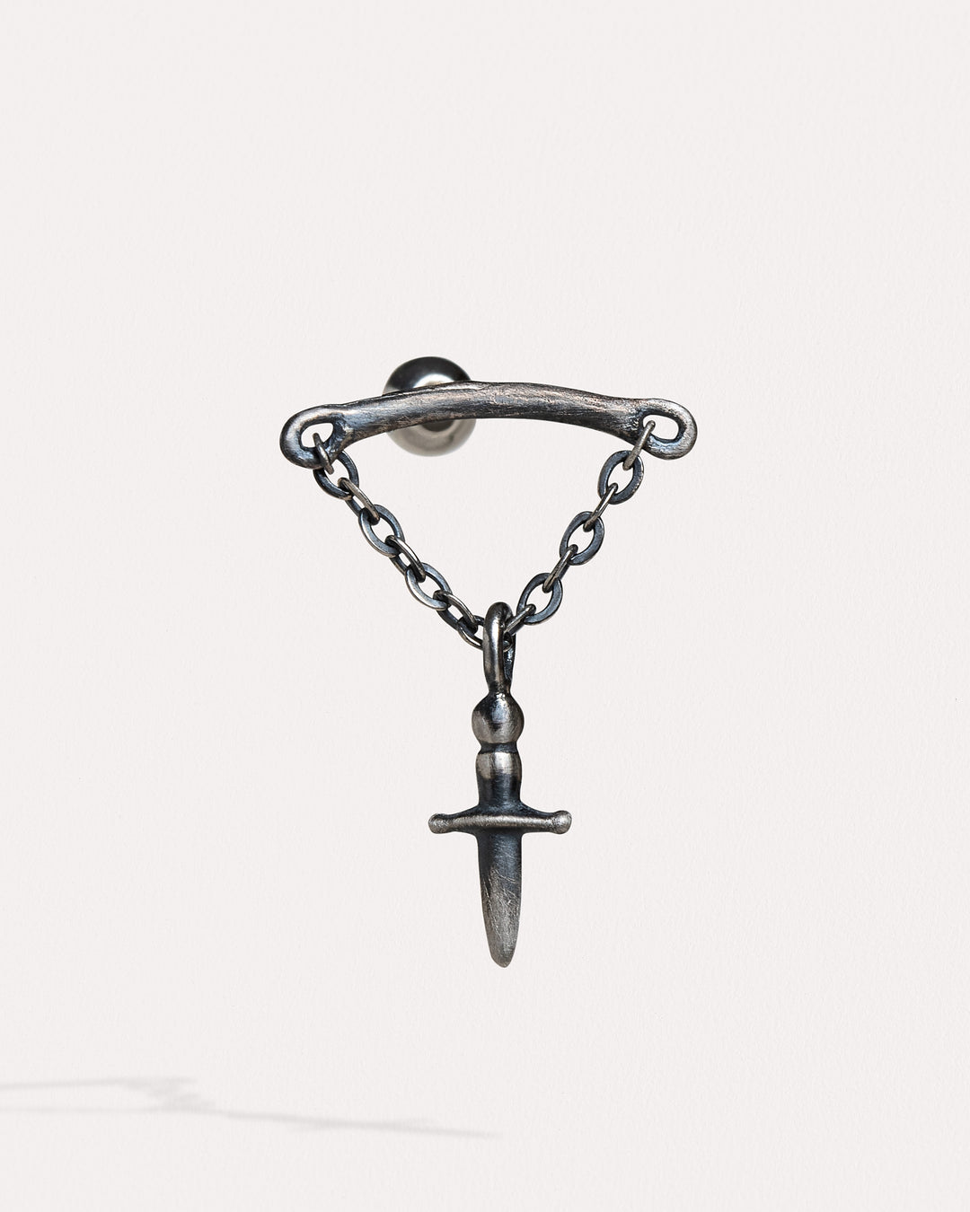 Silver helix sword-shaped flat back earrings with intricate design and detailing