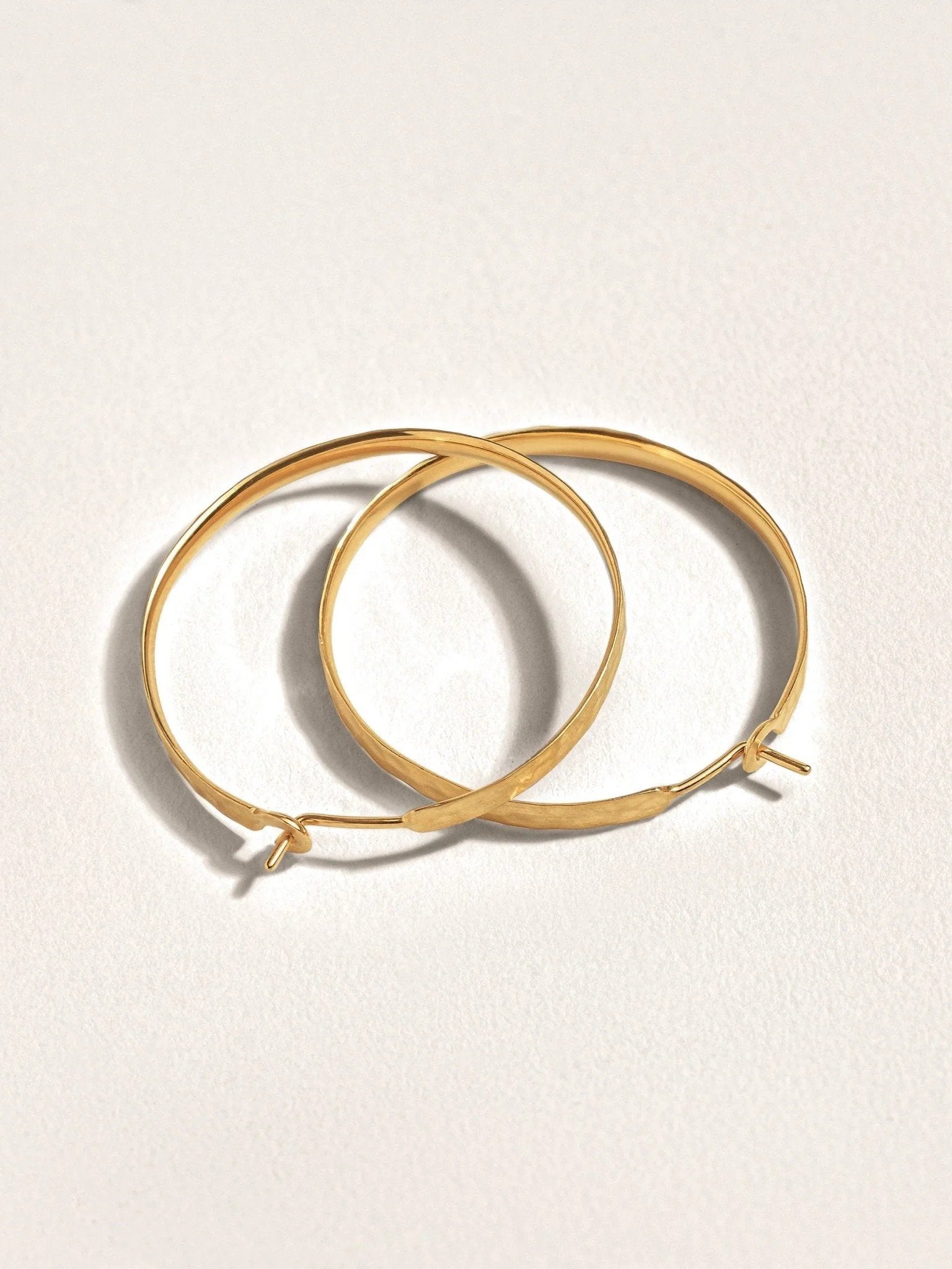 24K gold-plated matte hammered hoop earrings – handmade and sustainable design.