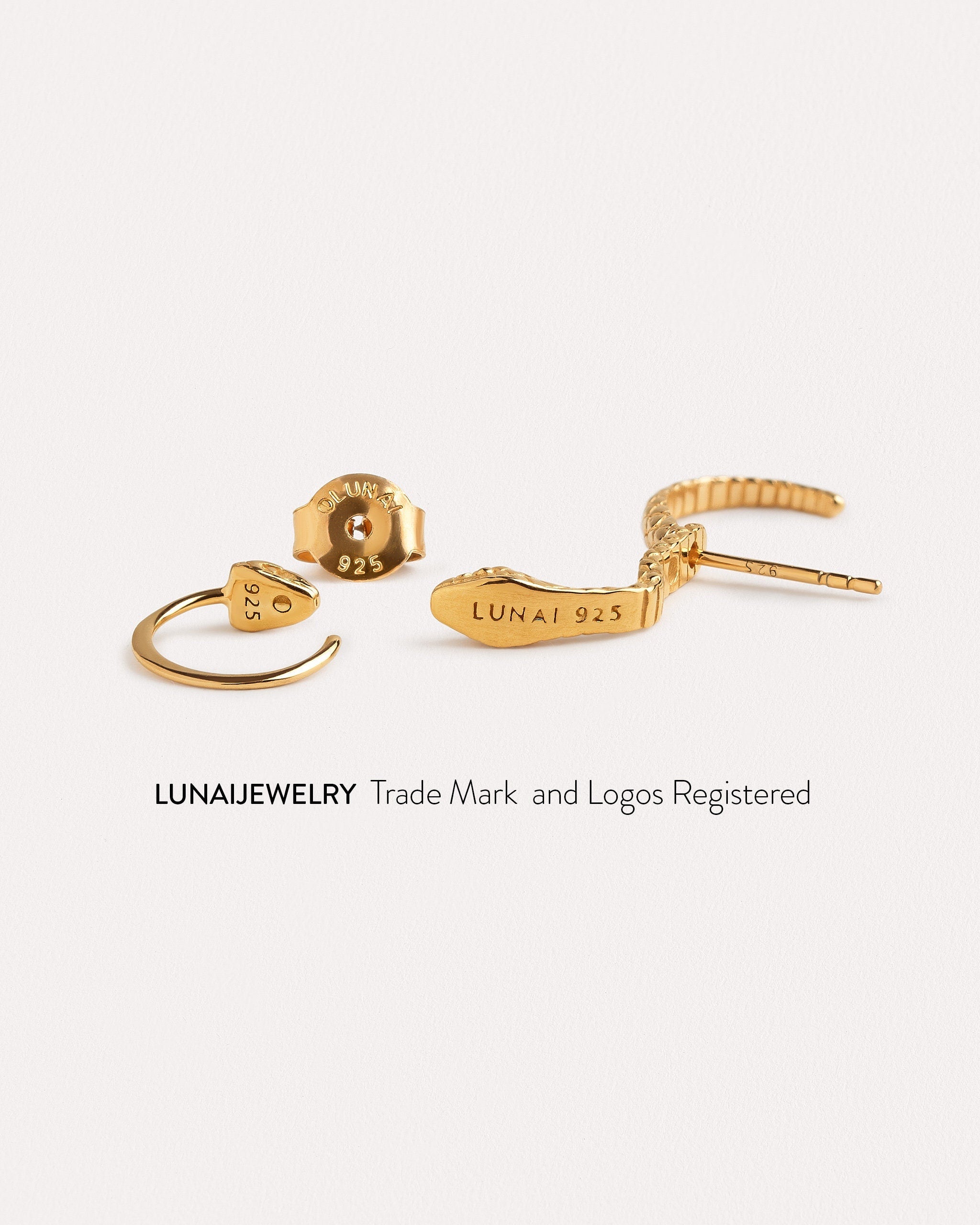 Lunai Jewelry registered trademark and logo displayed on our handcrafted snake ear jacket earrings.