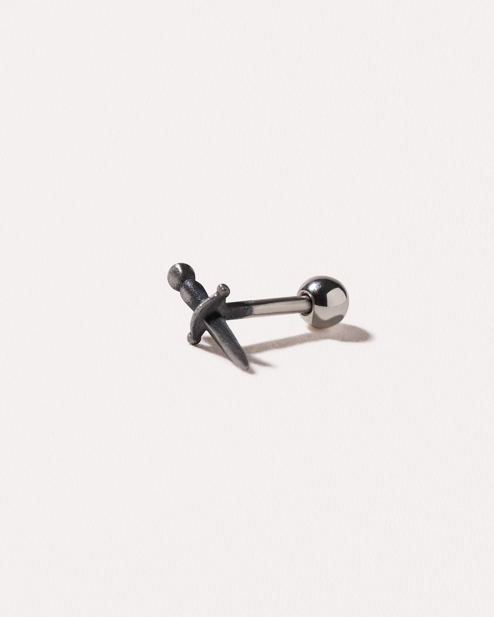 Oxidized sterling silver dagger earring with ball back – angled view